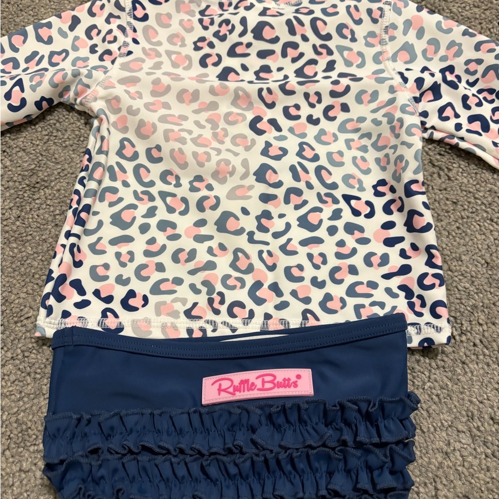 Ruffle Butts Pink and Blue Patterned Rash Guard